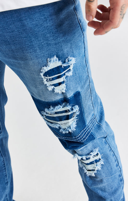 Jeans Slim Desgastados Con Patchwork Azul
